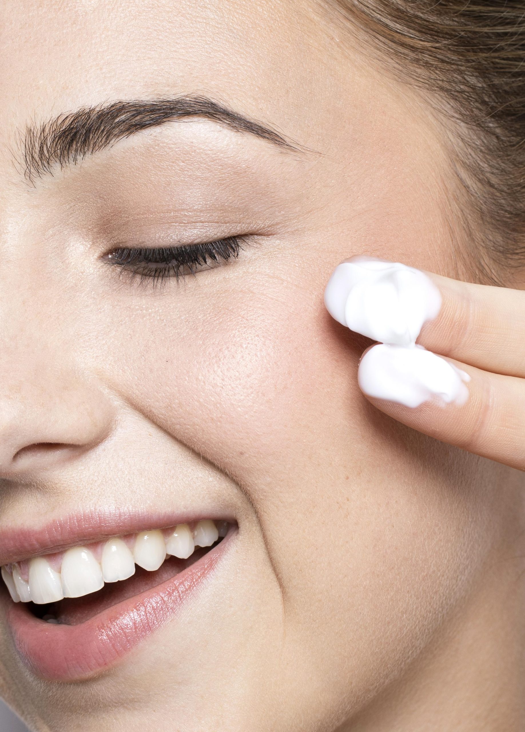 close-up-view-woman-with-cream-fingers